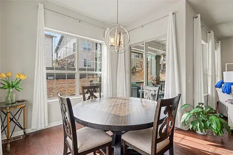 a view of a dining room with furniture window and wooden floor