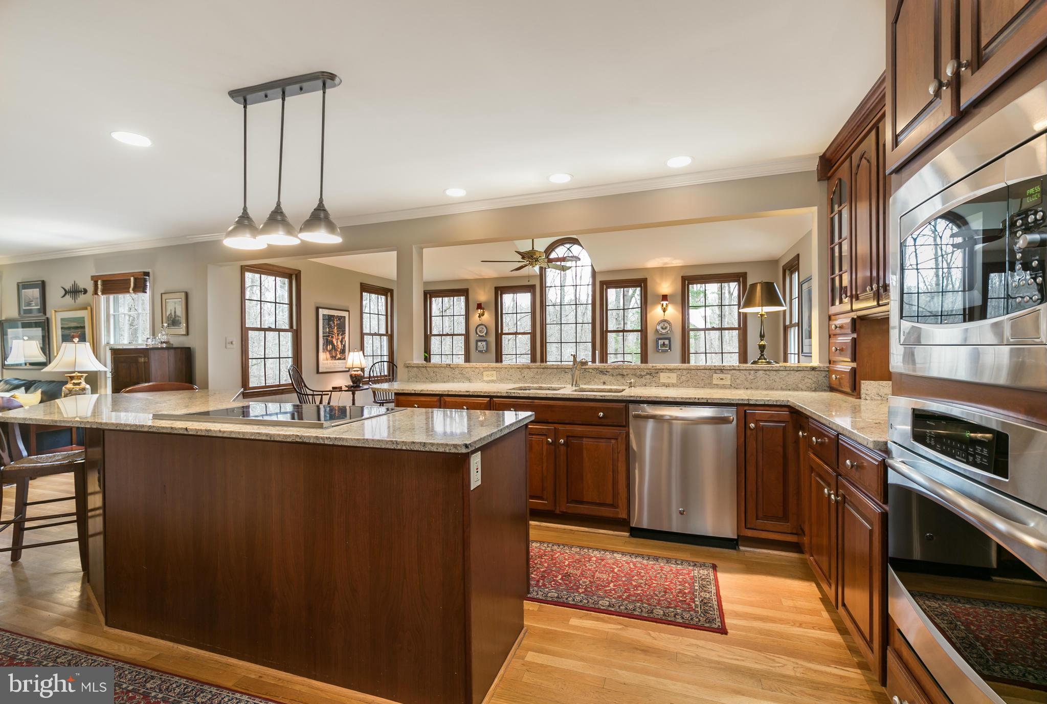 11006 Birdfoot Court Reston, VA 20191 - Photo 7 of 30 a kitchen with stainless steel appliances a sink stove and cabinets