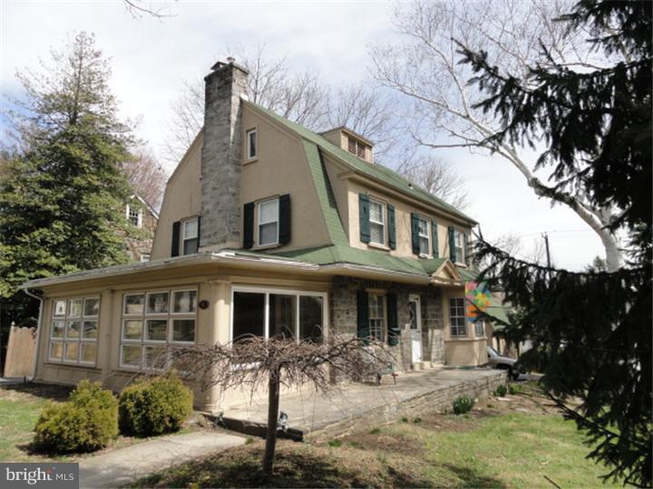 47 North Rolling Road Springfield, PA 19064 - Photo 1 of 16 a front view of a house with yard and parking