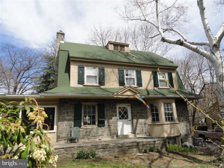 47 North Rolling Road Springfield, PA 19064 - Photo 2 of 16 a front view of a house with garden