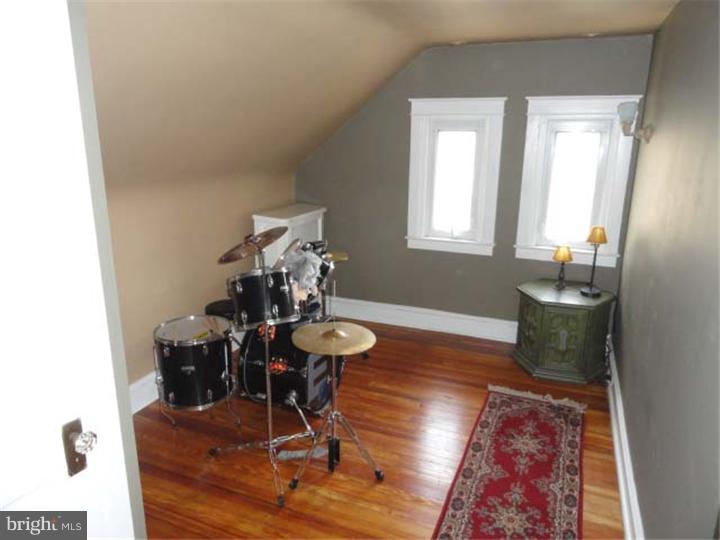 47 North Rolling Road Springfield, PA 19064 - Photo 11 of 16 a view of a dining room with furniture and wooden floor