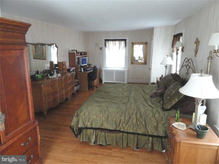 47 North Rolling Road Springfield, PA 19064 - Photo 7 of 16 a living room with furniture and a window