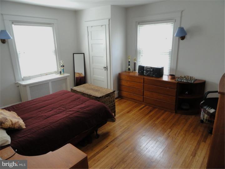 47 North Rolling Road Springfield, PA 19064 - Photo 8 of 16 a bedroom with a bed and window
