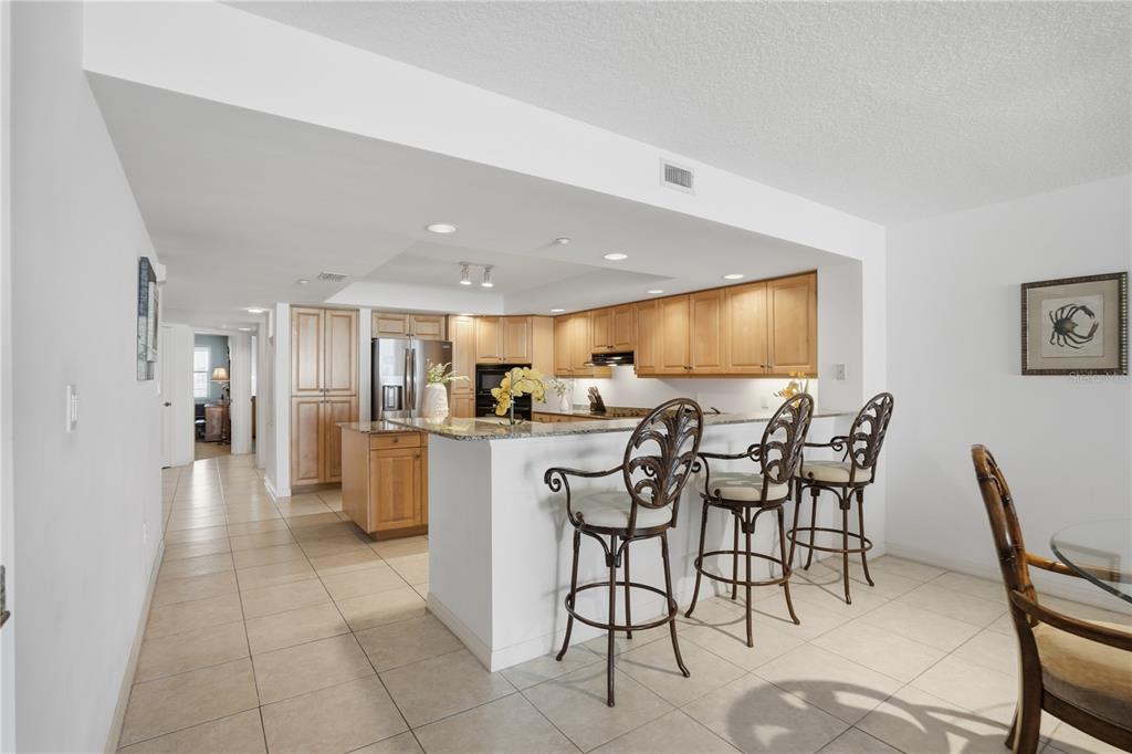16326 Gulf Boulevard, Unit 307 Redington Beach, FL 33708 - Photo 9 of 43 a view of a dining room kitchen and a window