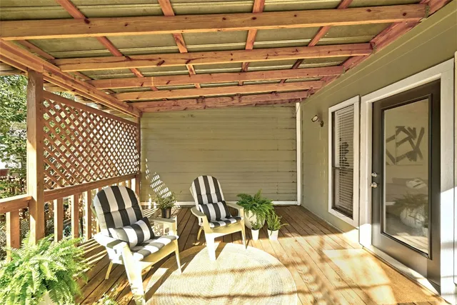a living room with furniture a window and a fireplace