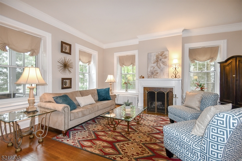 15 Euclid Avenue, Unit 3 Summit, NJ 07901 - Photo 6 of 10 a living room with furniture fireplace and a large window