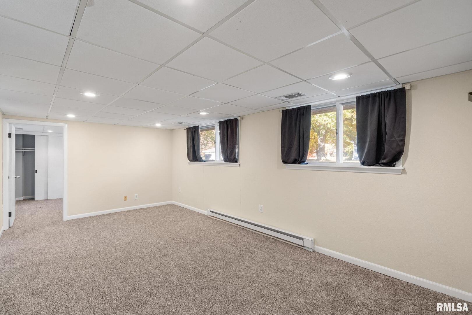204 Amber Lane Geneseo, IL 61254 - Photo 7 of 16 a view of an empty room with a window