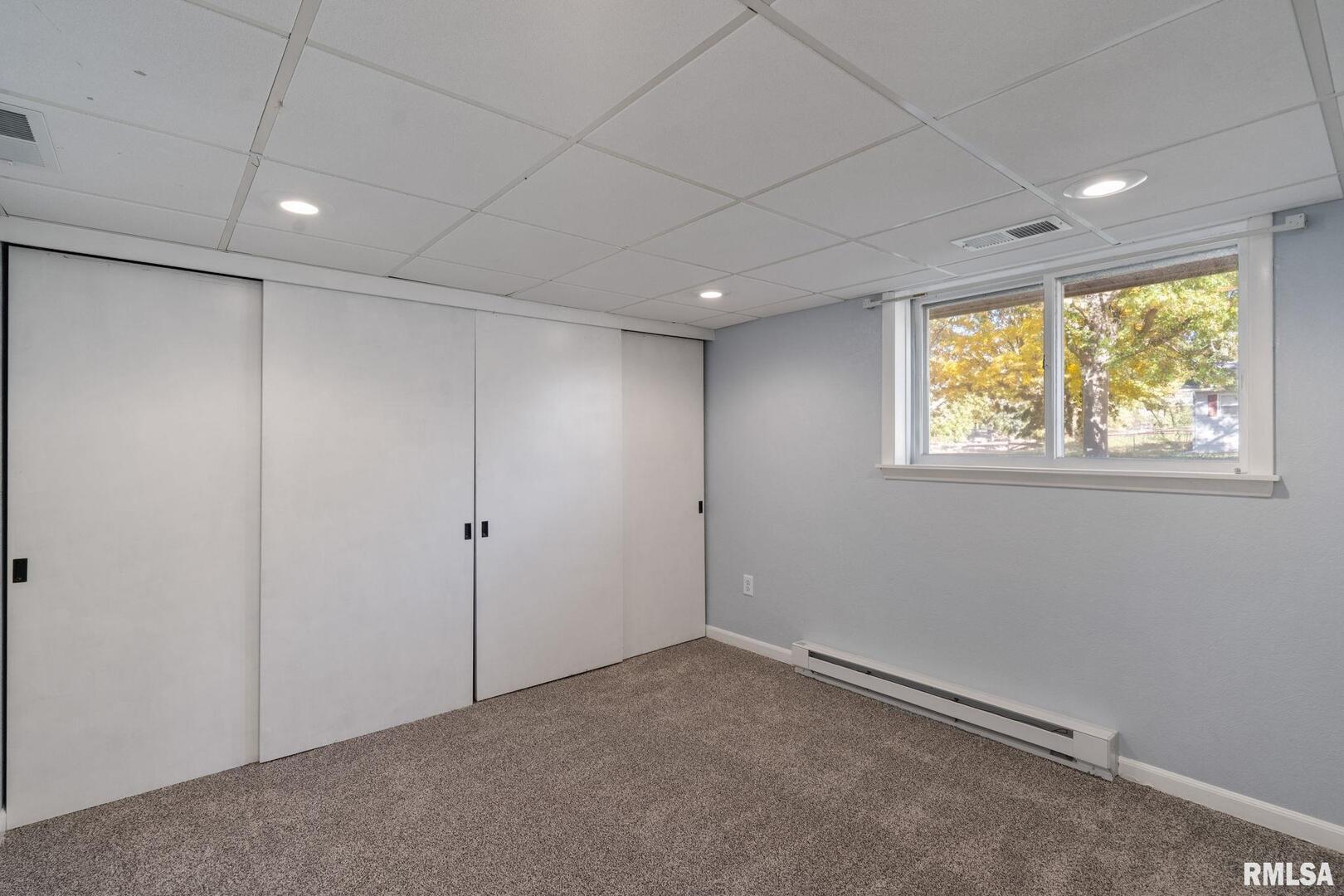 204 Amber Lane Geneseo, IL 61254 - Photo 9 of 16 a view of an empty room with a window