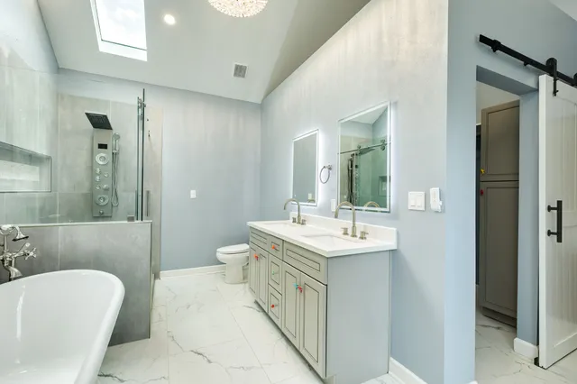 a white bath tub sitting in a bathroom