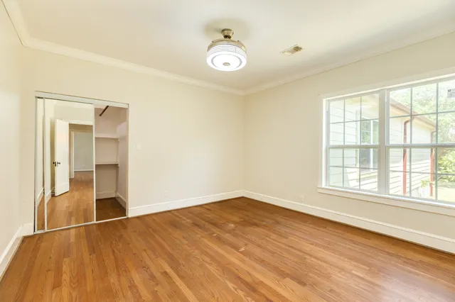 a spacious bathroom with a double vanity sink and mirror