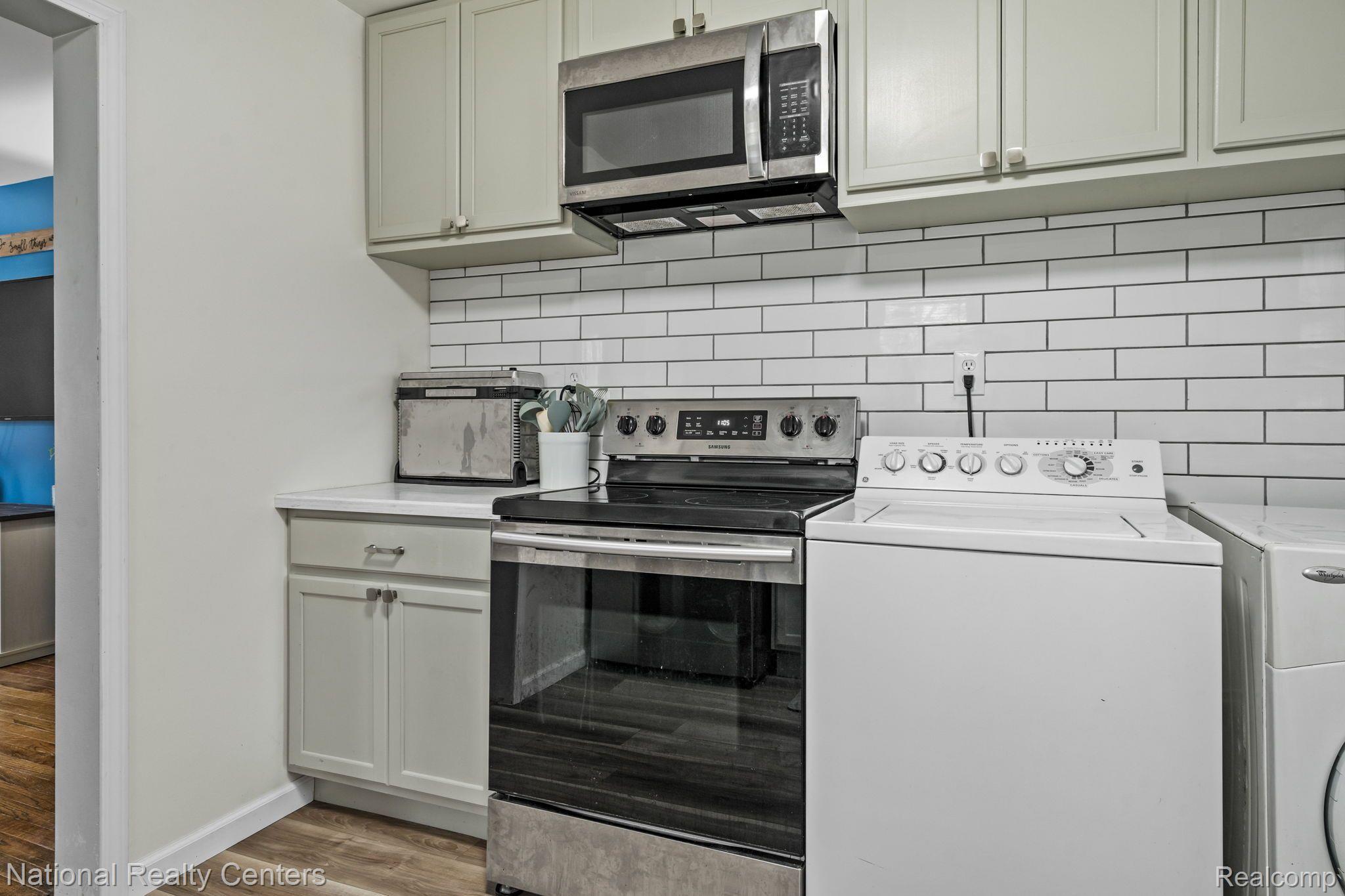 480 Brewer Road Leonard, MI 48367 - Photo 10 of 30 Gorgeous subway tile backsplash
