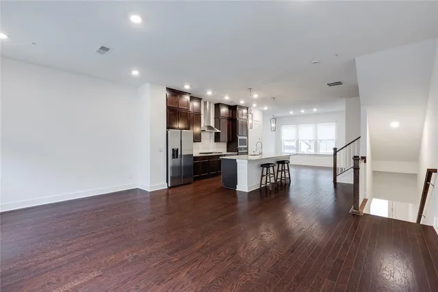 a view of kitchen with cabinets and wooden floor