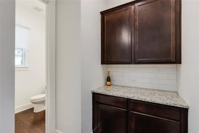 a bathroom with a sink toilet and a mirror