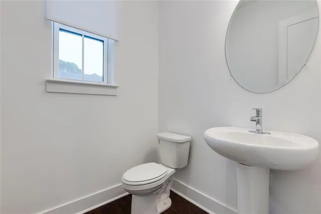 a view of a balcony with wooden floor and fence