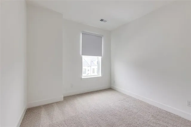 a bathroom with a tub a sink and a mirror