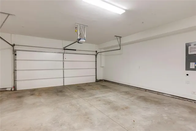 an aerial view of a house with outdoor space
