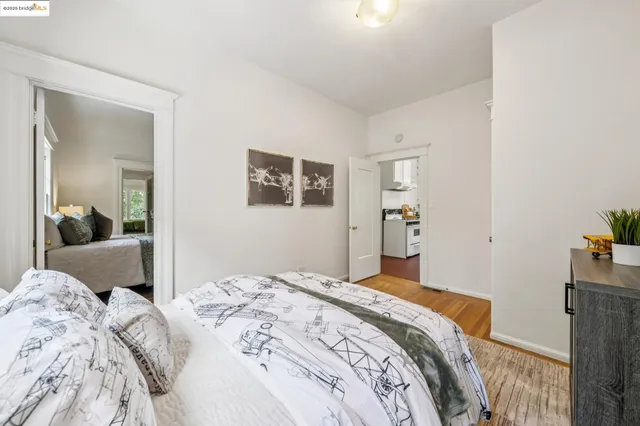 a bedroom with a bed and a mirror