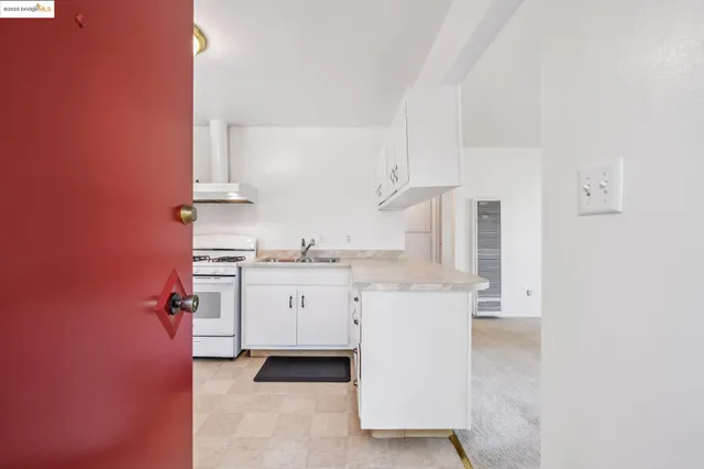 a room with view of kitchen and sink
