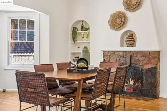 a dining room with furniture and window