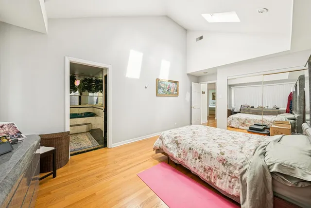 a bedroom with a bed and dresser