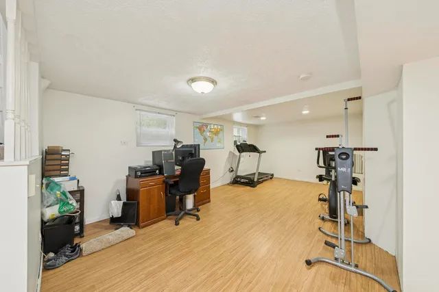 a view of a workspace with furniture and a livingroom