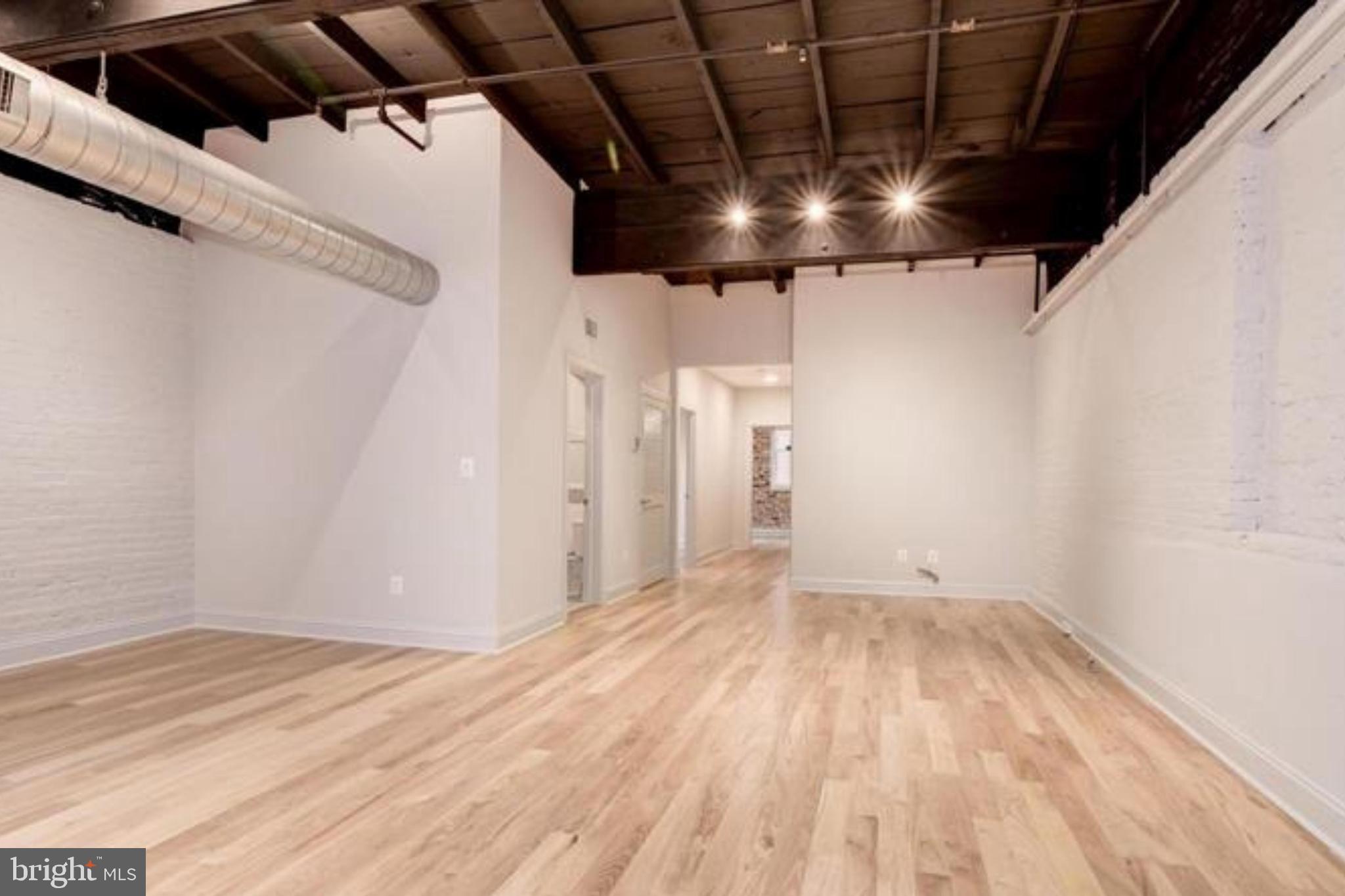 28 East Patrick Street, Unit 2 Frederick, MD 21701 - Photo 12 of 13 a view of empty room with wooden floor