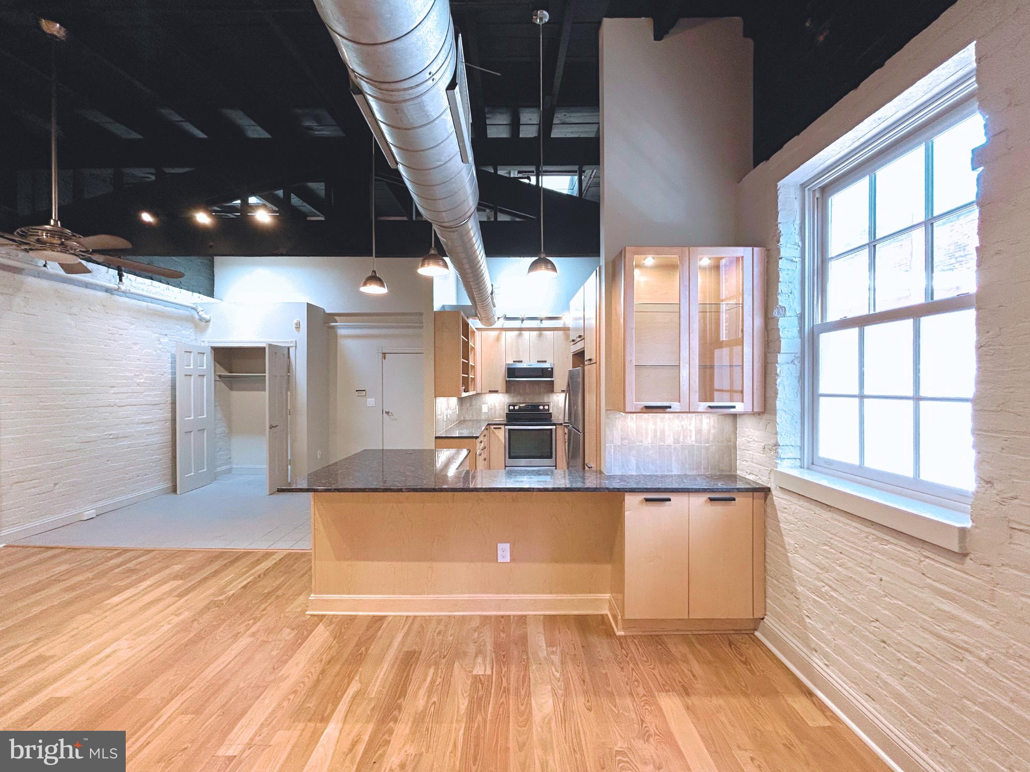 28 East Patrick Street, Unit 2 Frederick, MD 21701 - Photo 10 of 13 a view of a living room with a large window