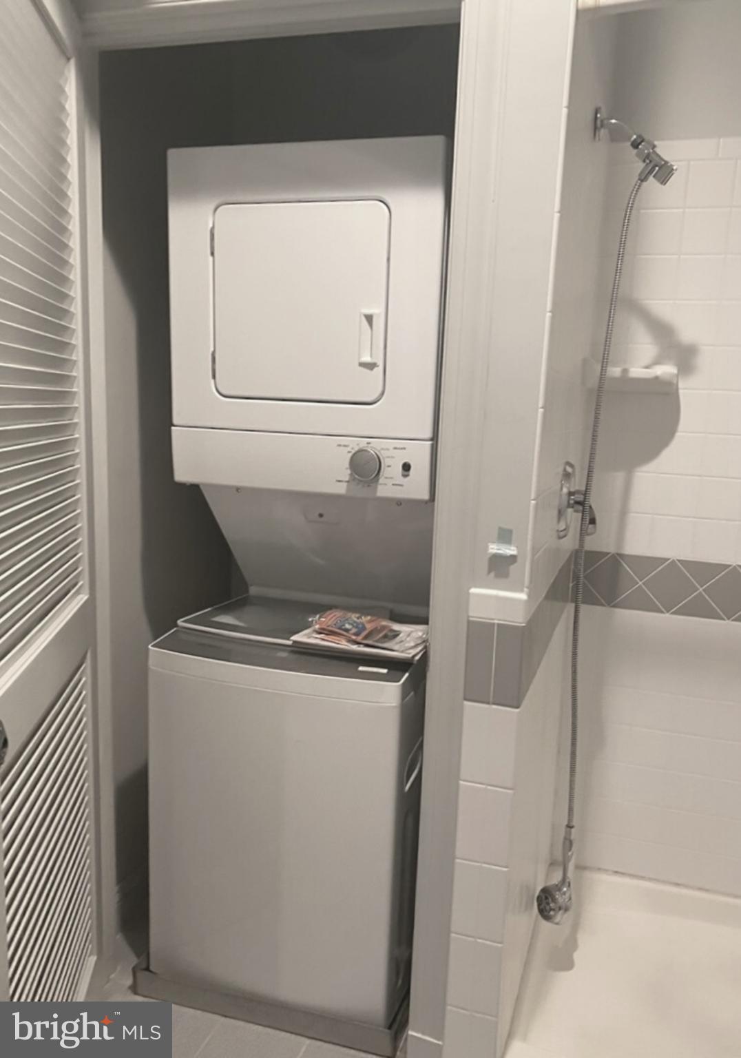 28 East Patrick Street, Unit 2 Frederick, MD 21701 - Photo 7 of 13 a utility room with dryer and washer