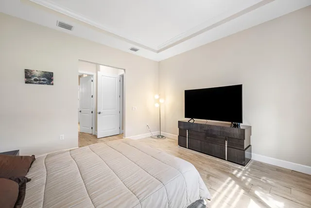 a bathroom with a white toilet and shower