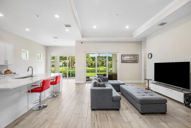a living room with furniture window and flat screen tv
