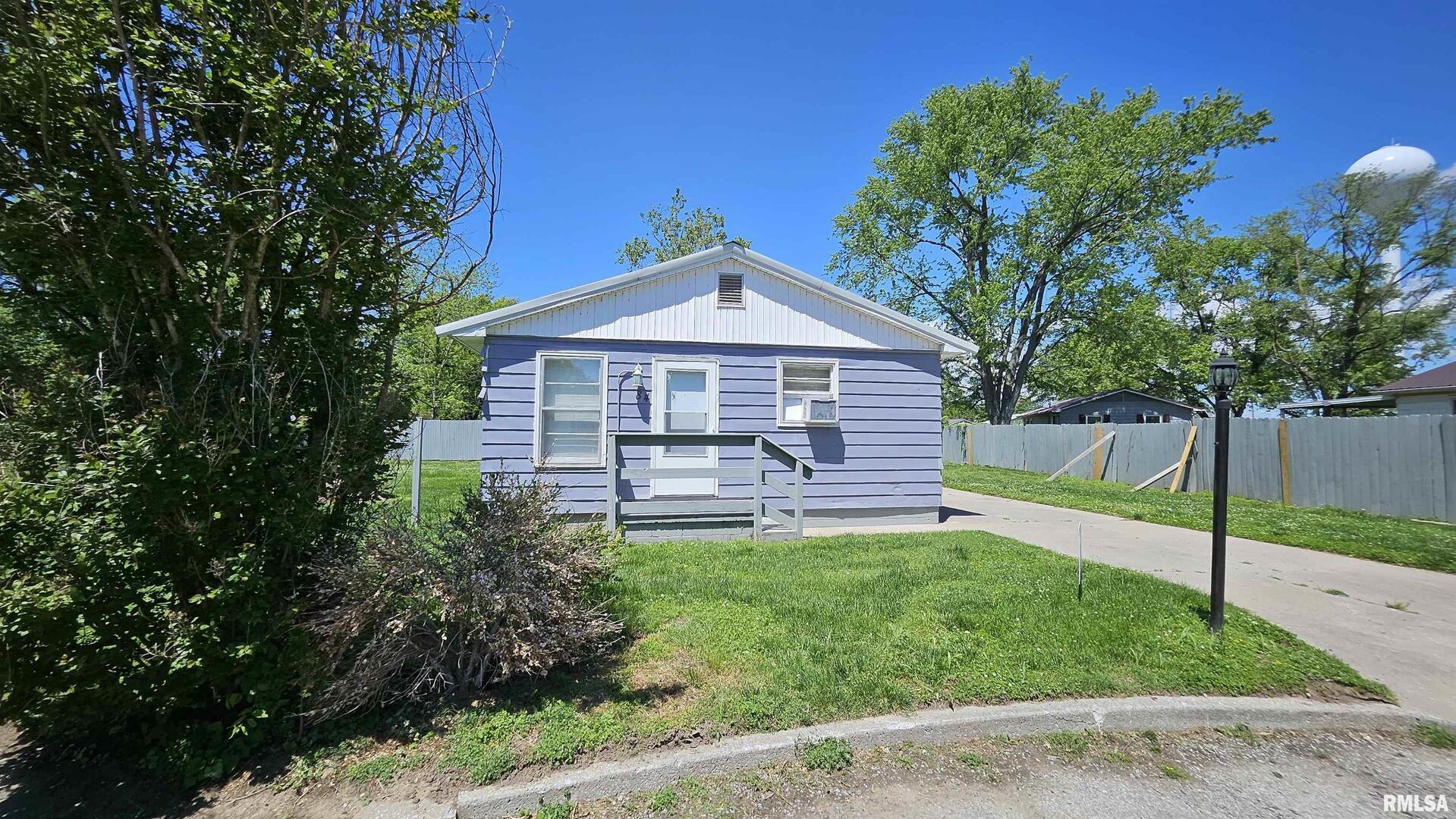 84 Yakima Circle McClure, IL 62957 - Photo 2 of 9 a front view of a house with garden