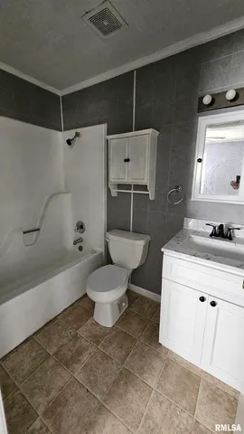 a bathroom with a toilet and a bathtub