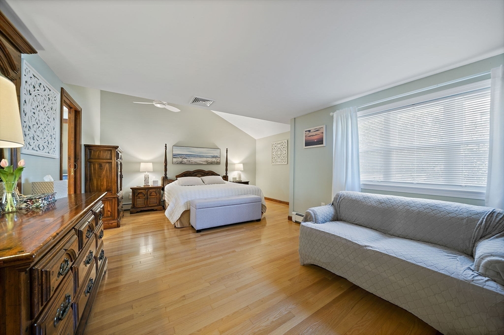 45 Pond Circle Mashpee, MA 02649 - Photo 13 of 26 a bedroom with furniture and a window