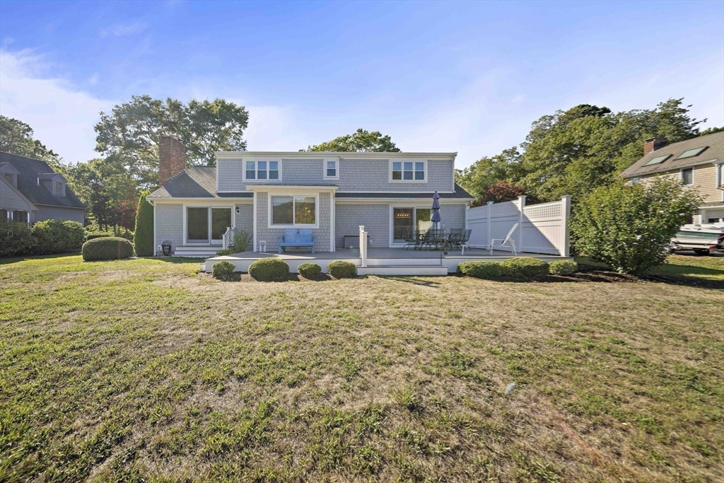 45 Pond Circle Mashpee, MA 02649 - Photo 24 of 26 a front view of a house with a yard