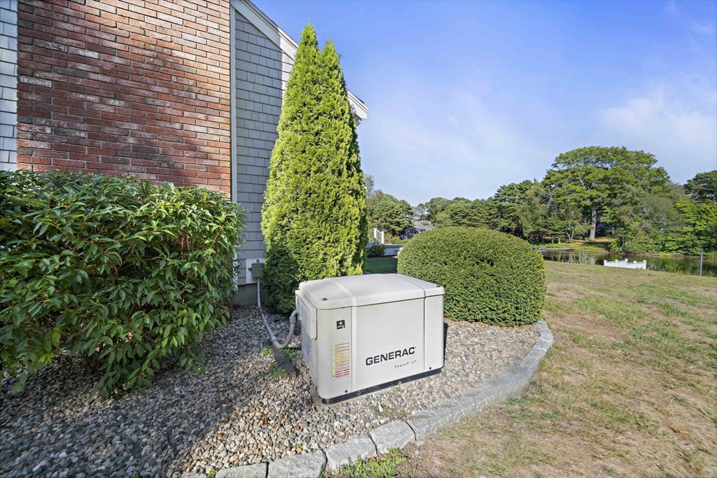 45 Pond Circle Mashpee, MA 02649 - Photo 25 of 26 a view of a pathway in outside of the house