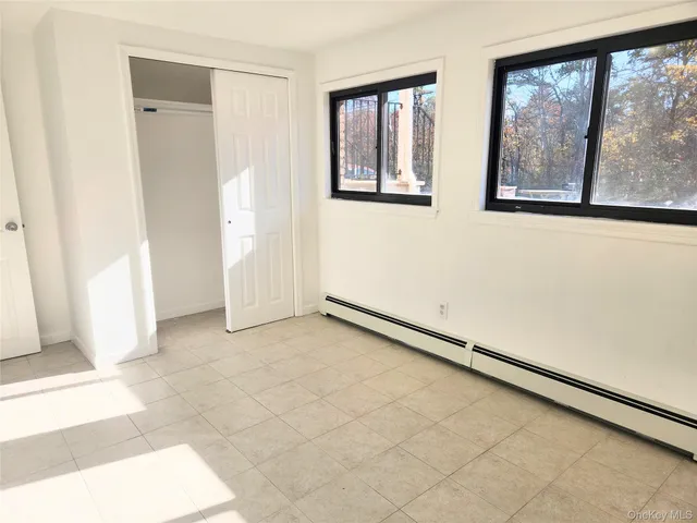 a view of a room with a large window