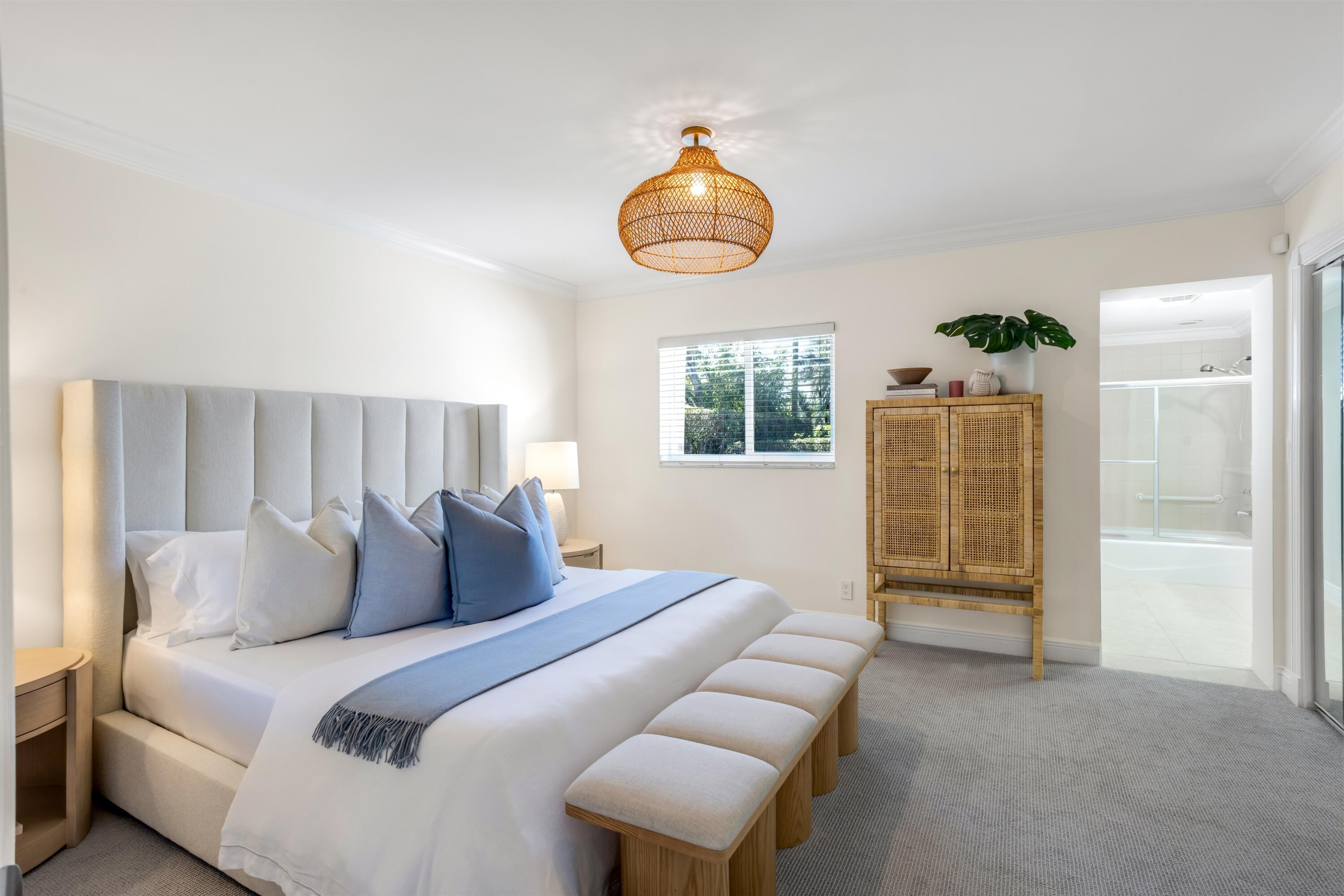 481 Northwest 5th Avenue Boca Raton, FL 33432 - Photo 16 of 28 a bedroom with bed and wooden floor