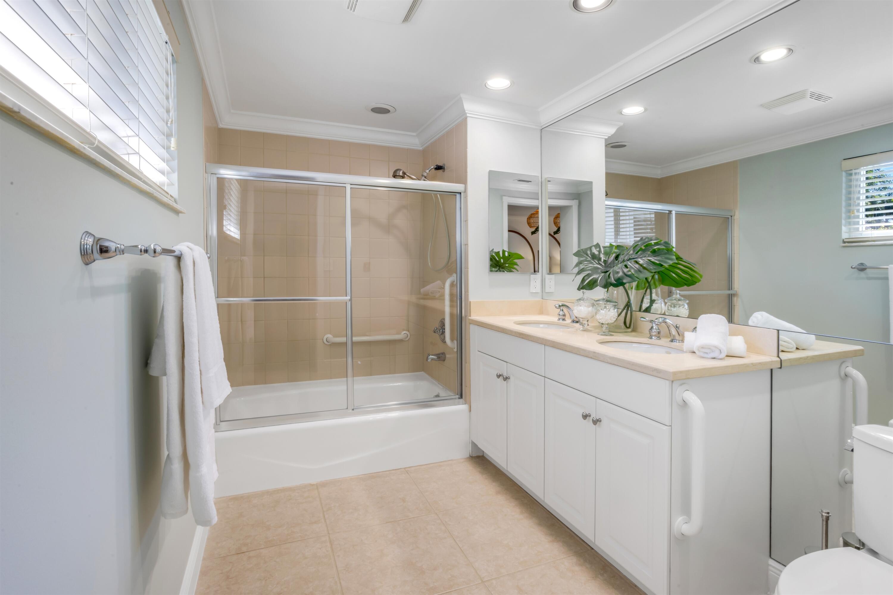 481 Northwest 5th Avenue Boca Raton, FL 33432 - Photo 19 of 28 a bathroom with a granite countertop sink mirror and a bathtub