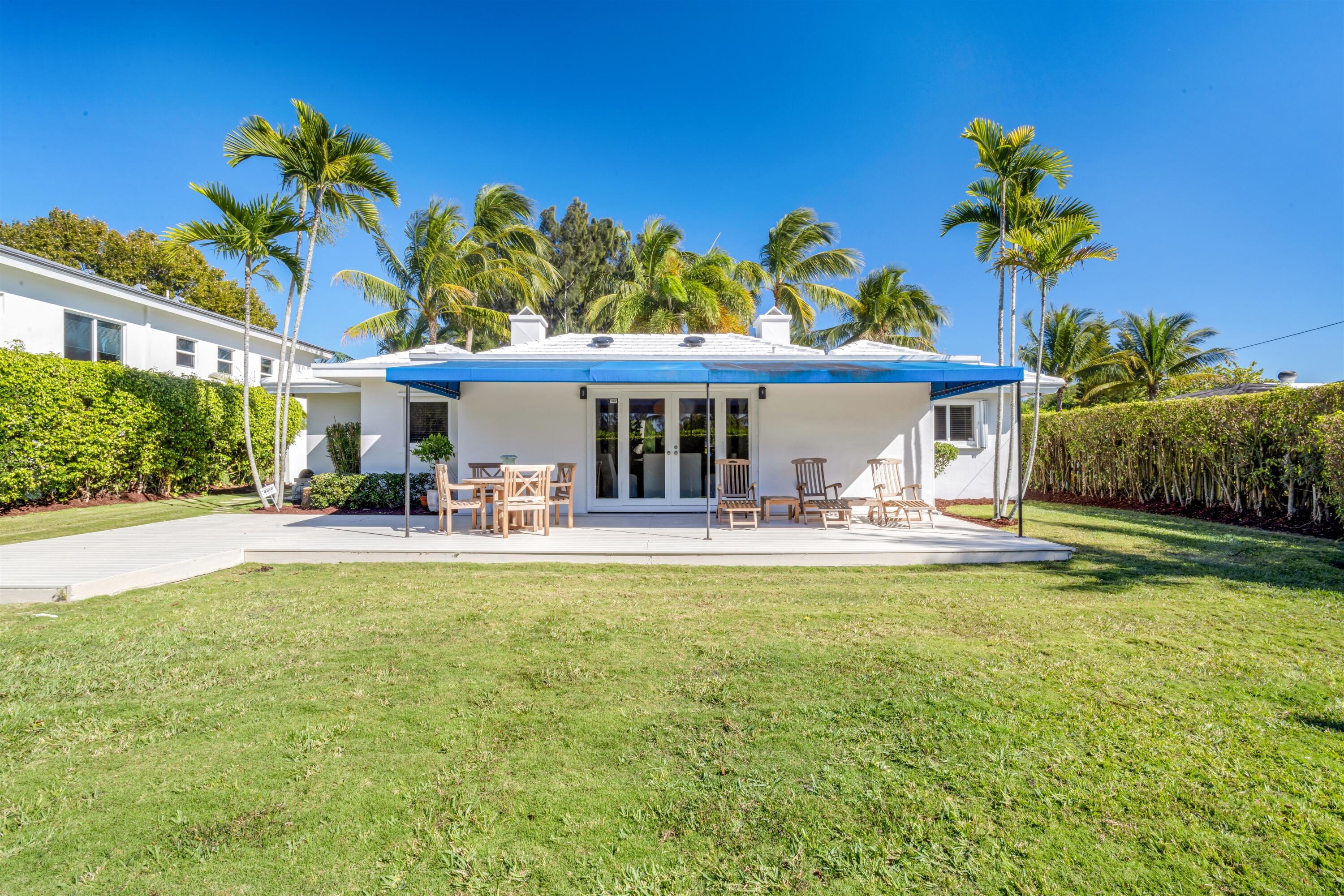 481 Northwest 5th Avenue Boca Raton, FL 33432 - Photo 26 of 28 a front view of a house with swimming pool having outdoor seating