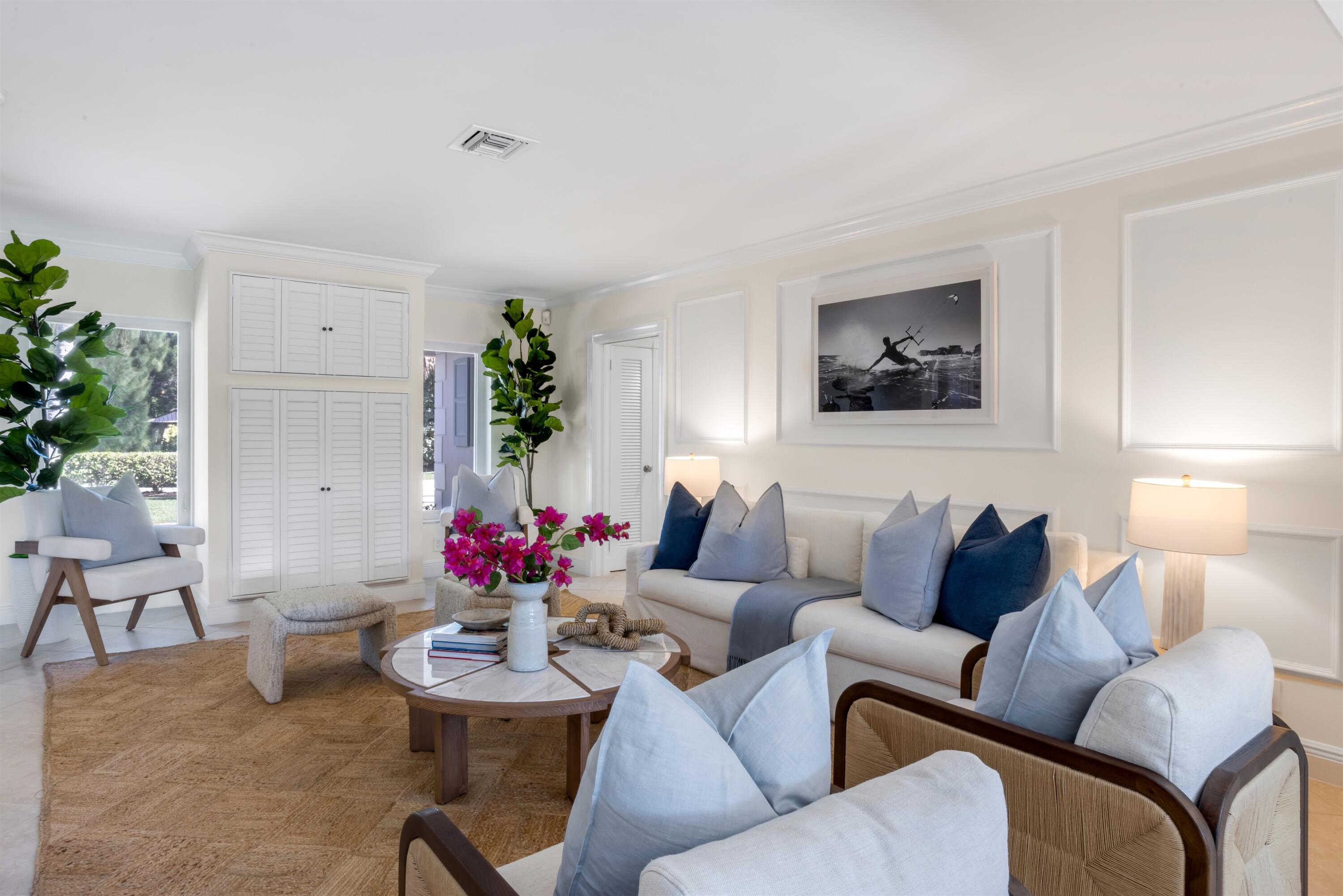 481 Northwest 5th Avenue Boca Raton, FL 33432 - Photo 7 of 28 a living room with furniture flowers and a chandelier