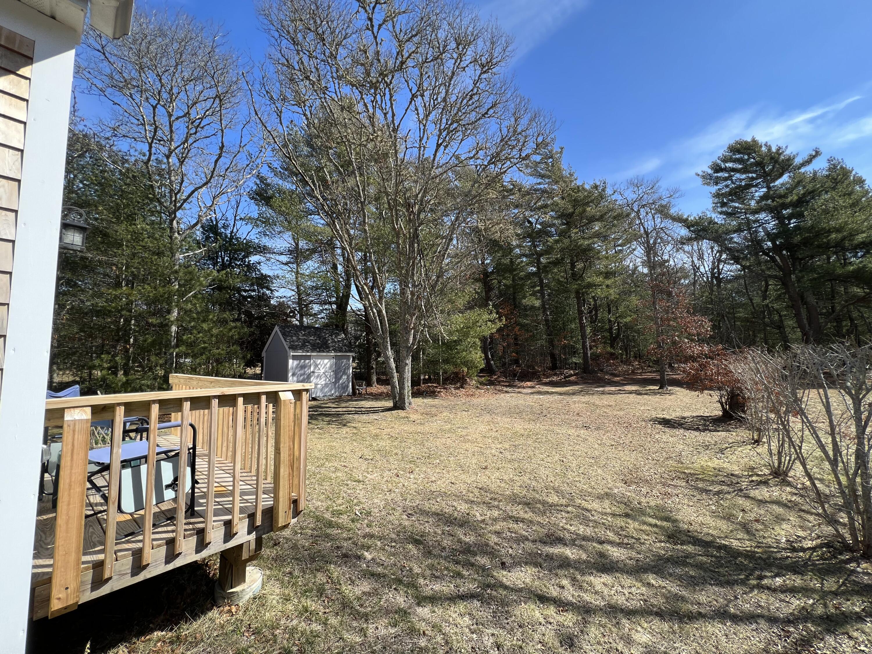 110 Degrass Road Mashpee, MA 02649 - Photo 11 of 46 a view of a chairs with yard in the back