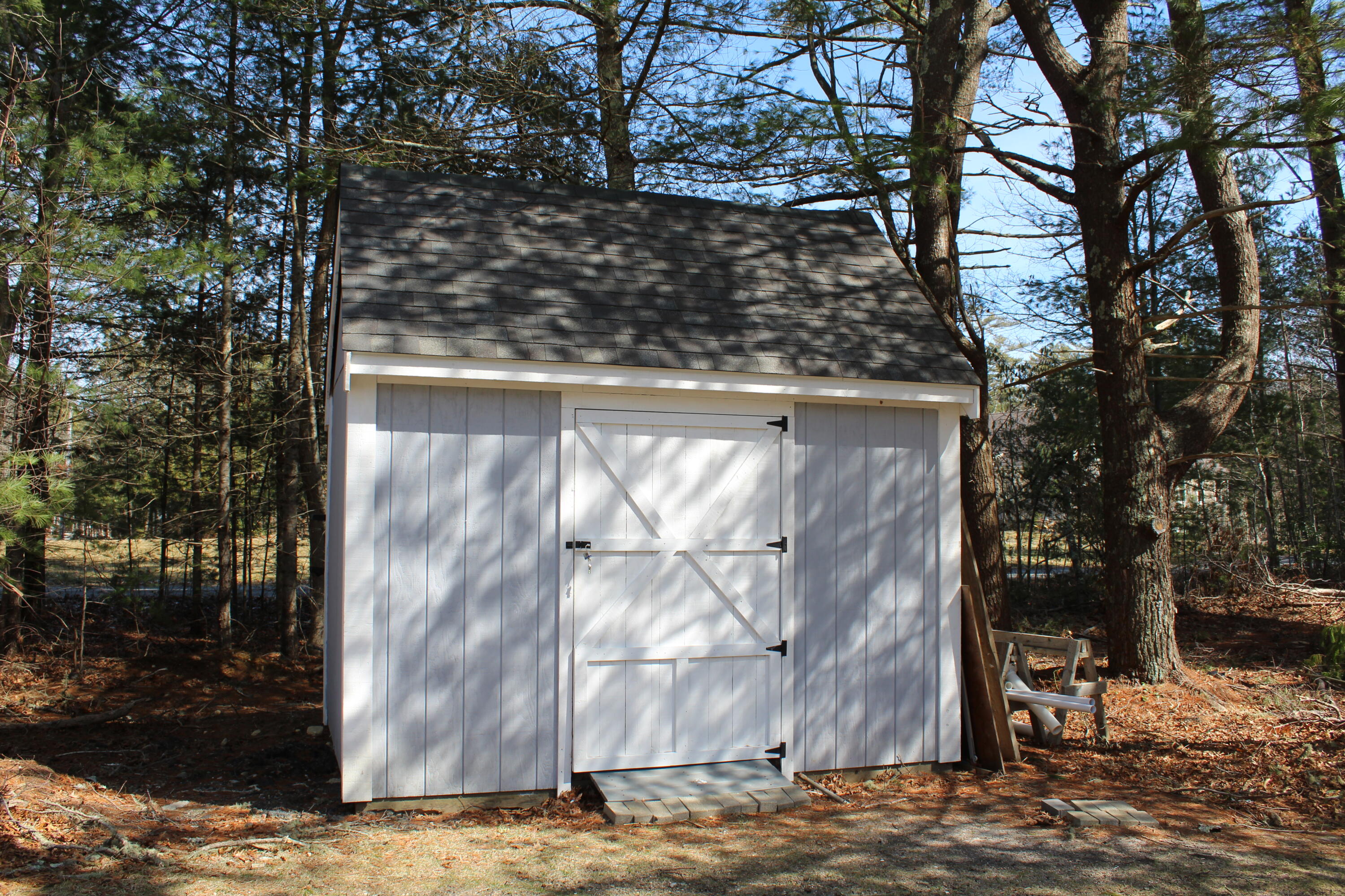 110 Degrass Road Mashpee, MA 02649 - Photo 12 of 46 a view of backyard with wooden fence and large trees