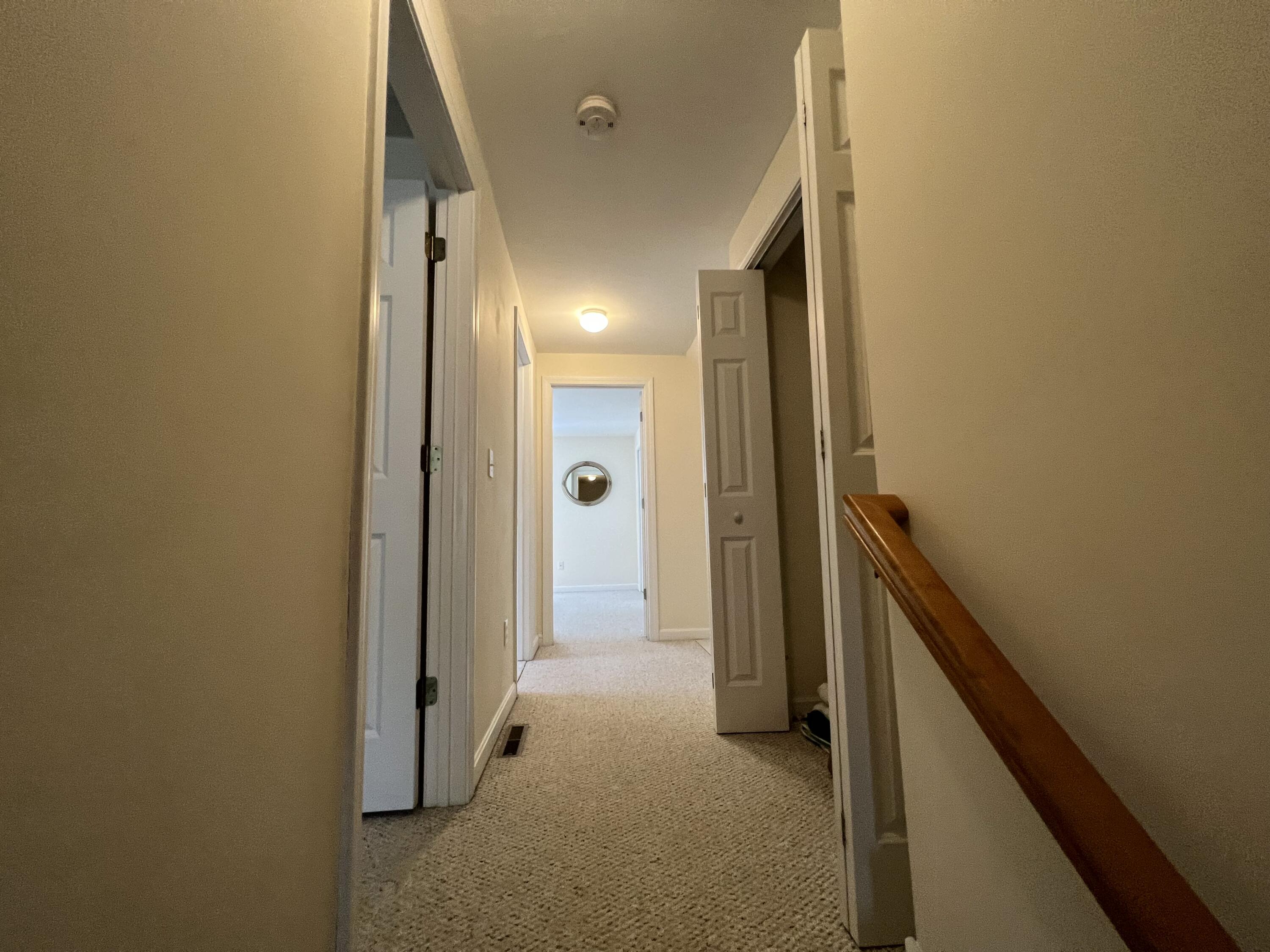 110 Degrass Road Mashpee, MA 02649 - Photo 18 of 46 a view of a hallway with wooden shelves