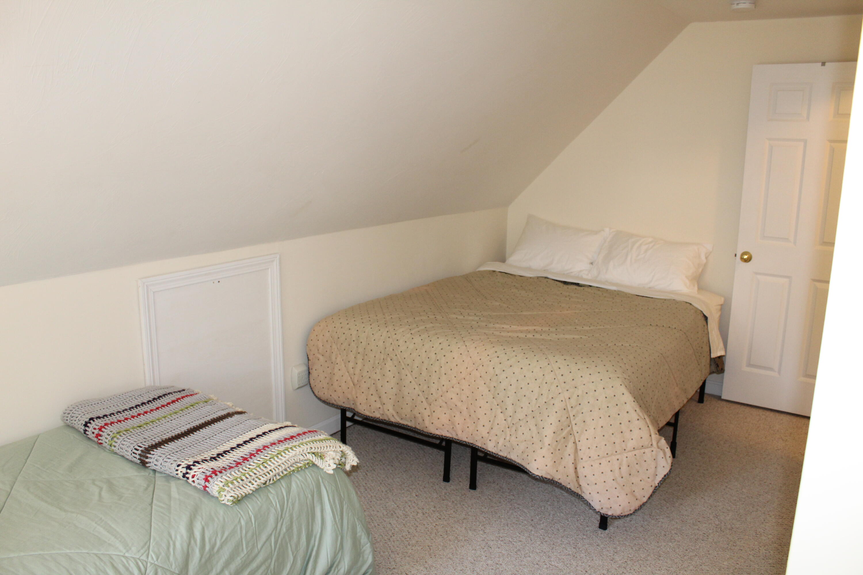110 Degrass Road Mashpee, MA 02649 - Photo 21 of 46 a bedroom with a bed and a night stand