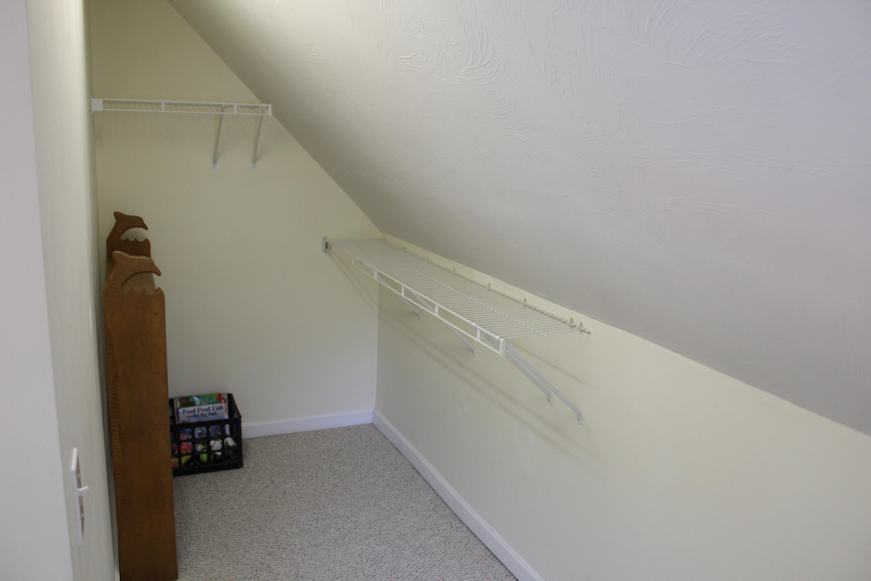 110 Degrass Road Mashpee, MA 02649 - Photo 23 of 46 a view of storage and utility room with empty racks