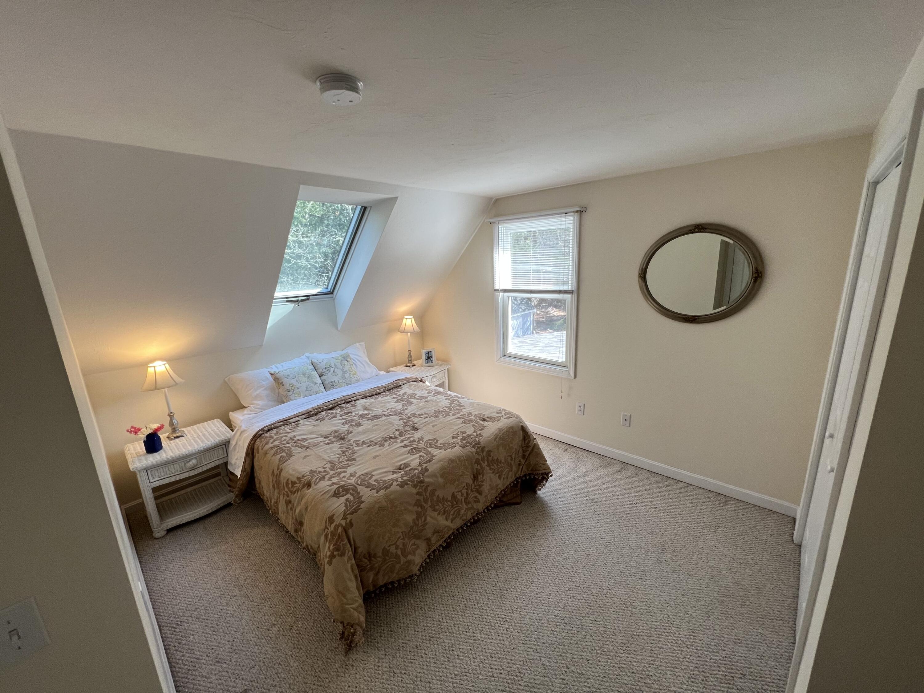 110 Degrass Road Mashpee, MA 02649 - Photo 24 of 46 a bedroom with a bed and a window