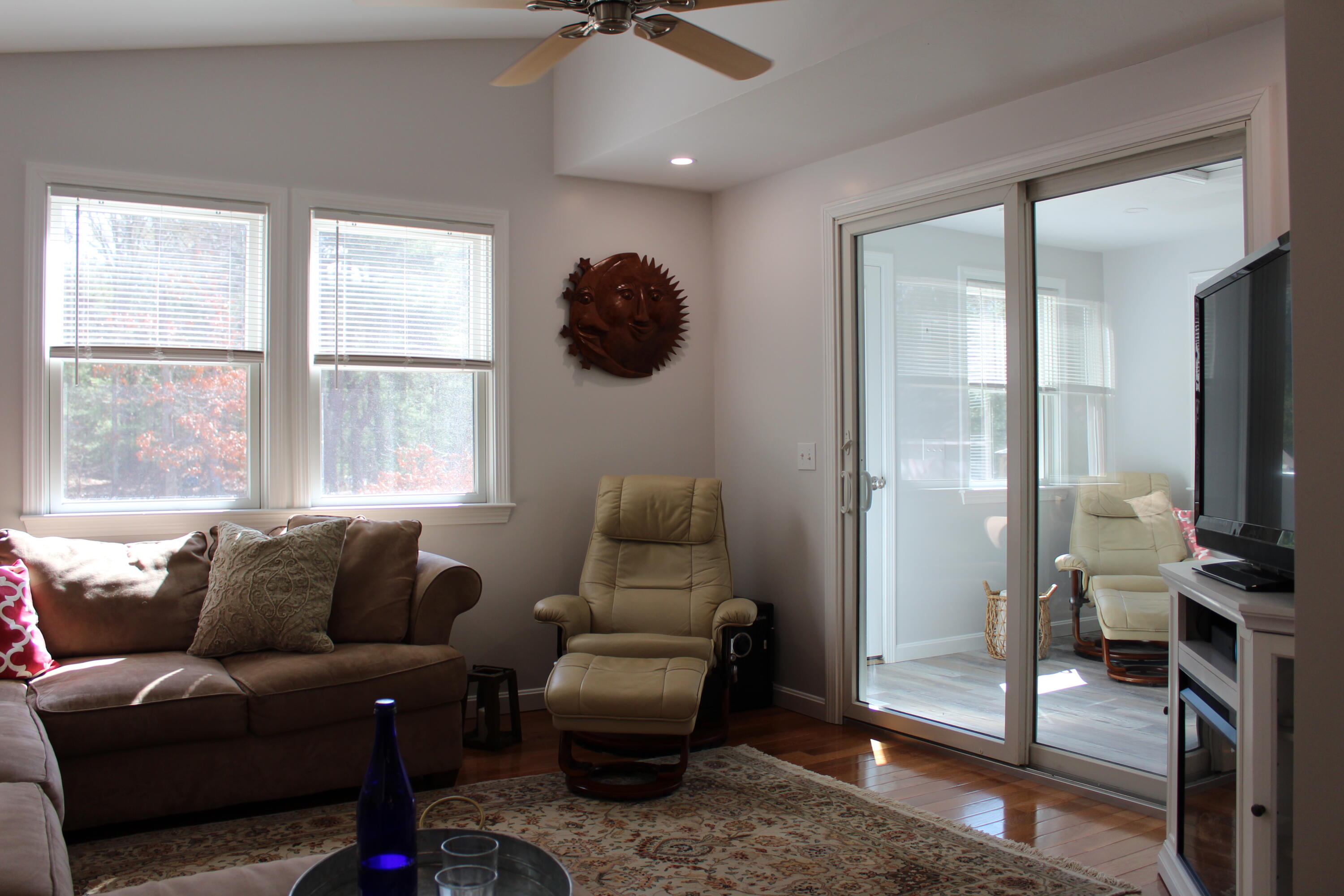 110 Degrass Road Mashpee, MA 02649 - Photo 36 of 46 a living room with furniture and a flat screen tv