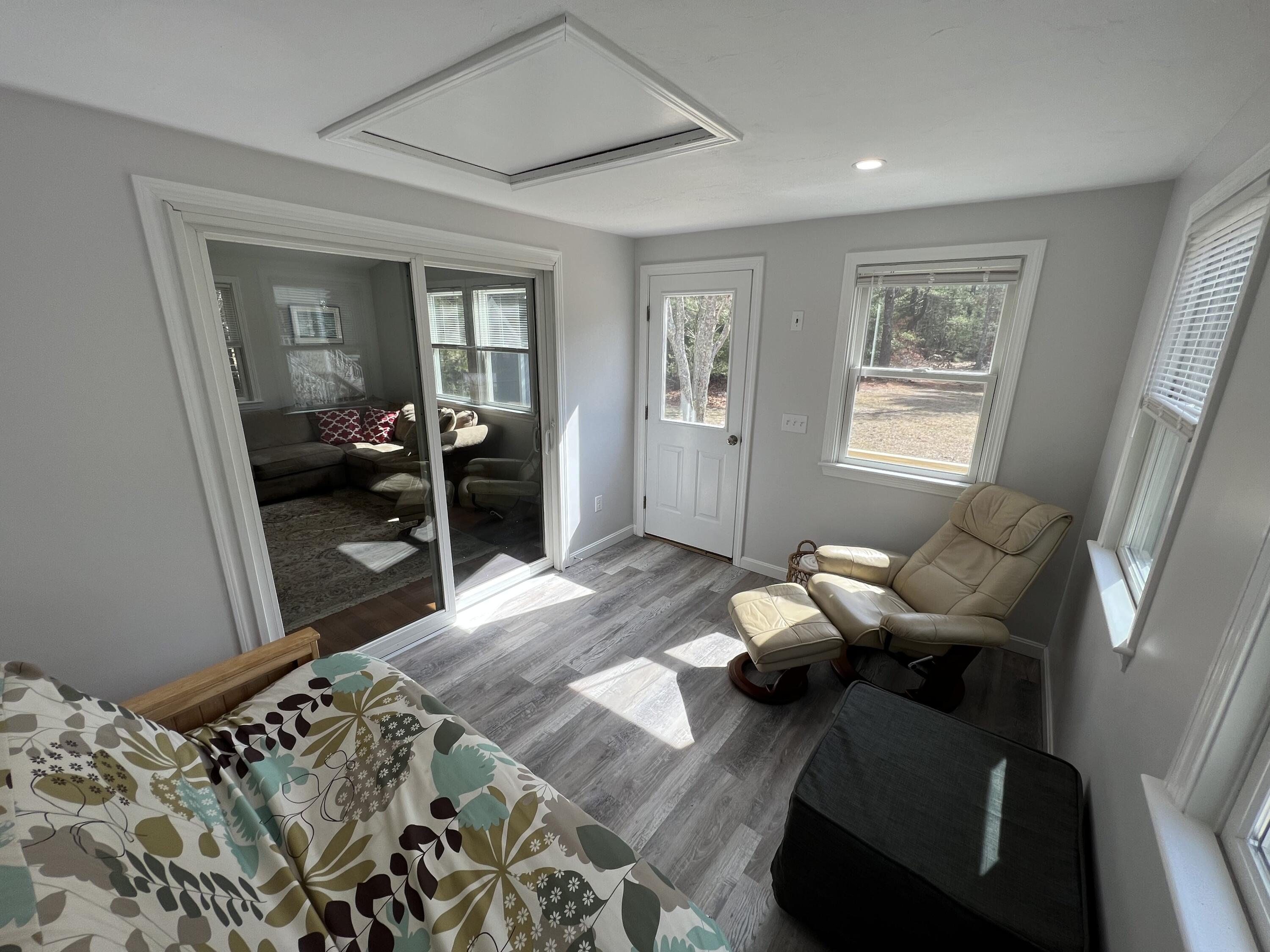 110 Degrass Road Mashpee, MA 02649 - Photo 38 of 46 a living room with furniture and a window