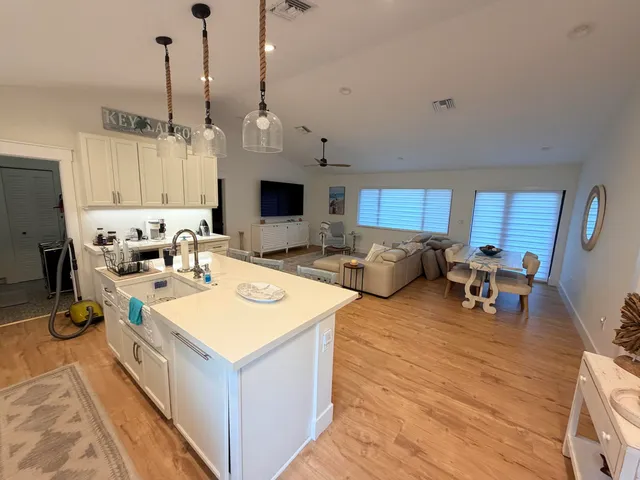 a living room with furniture a table and chairs