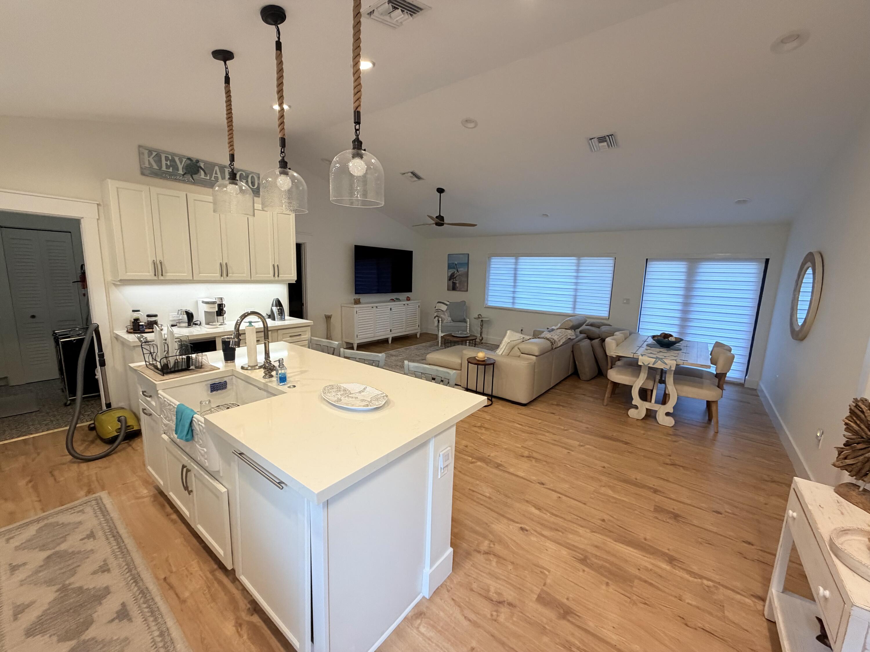 341 Sunset Drive Key Largo, FL 33037 - Photo 11 of 19 a living room with furniture a table and chairs
